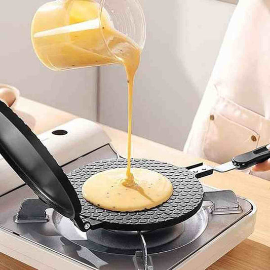 Versage de pâte à crêpe sur la plaque chauffante antiadhésive d'une crêpière électrique HautPerformance.