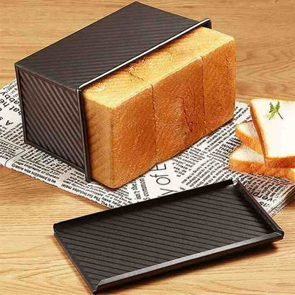 Moule à pain de mie professionnel avec couvercle coulissant, revêtement antiadhésif bronze pour une cuisson homogène et un démoulage facile.
